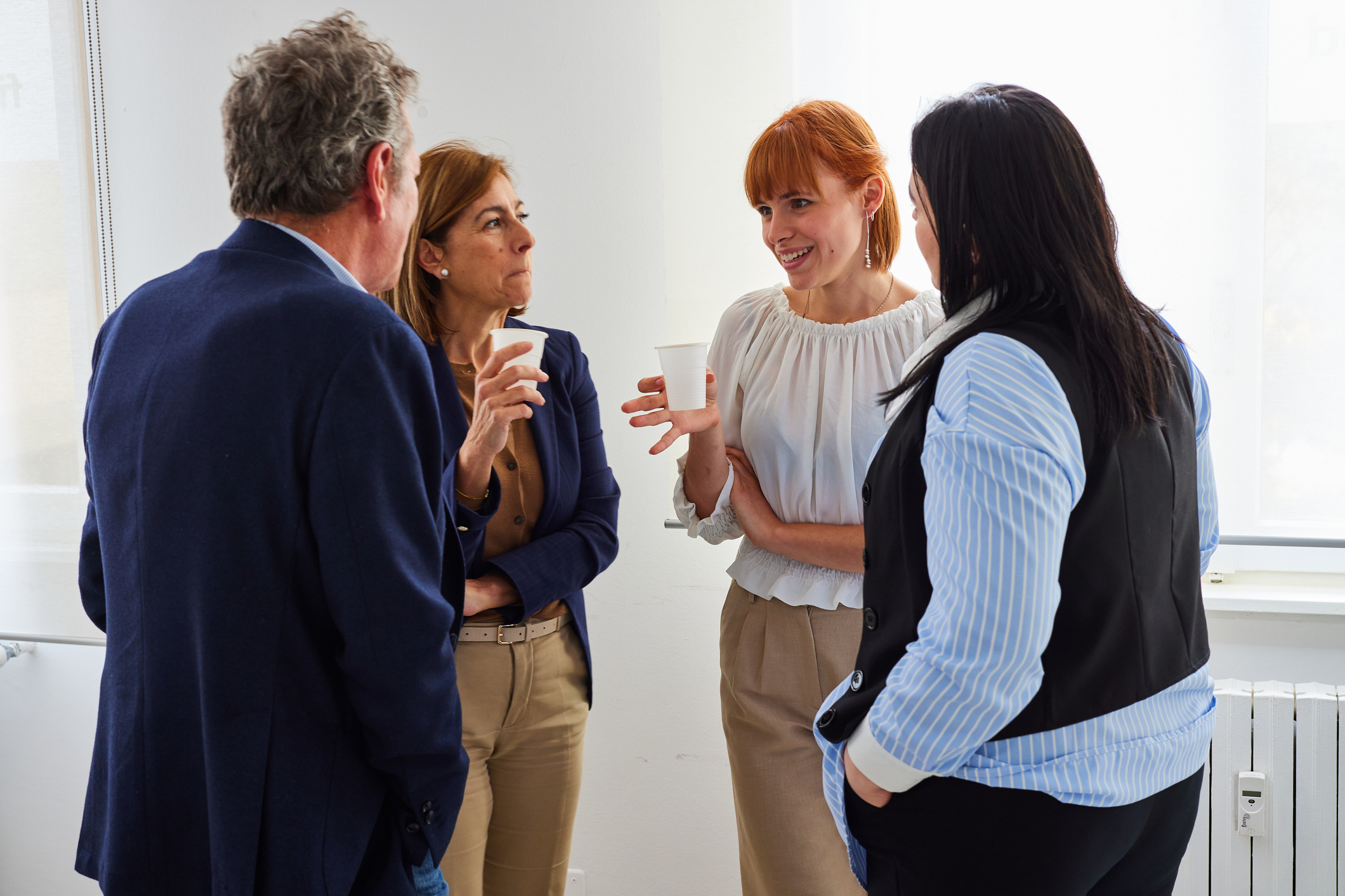 A group of preofessionals having a conversation