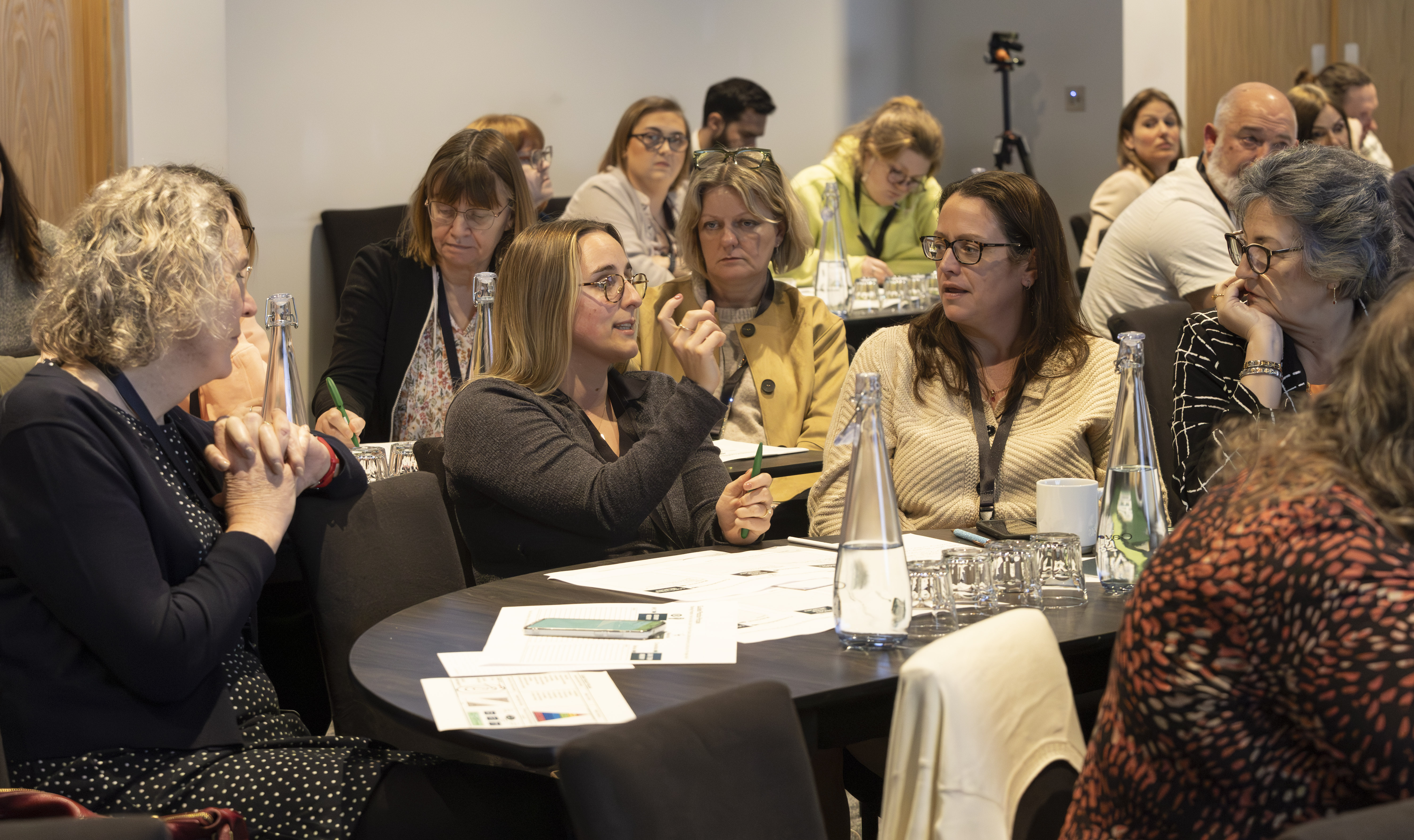 A group of professionals having a discussion at a conference